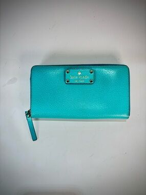 Kate spade pebble leather wallet with gold polka-dot lining. Excellent condition